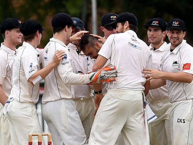 Penrith team mates congratulate bowler Josh Lalor.