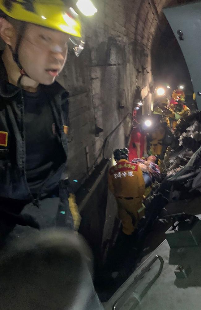 Taiwan Red Cross shows rescue teams at the site where the train derailed. Picture: Taiwan Red Cross/ AFP