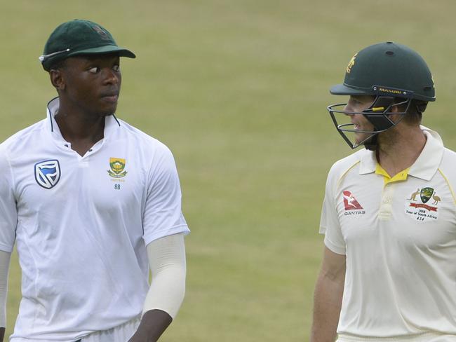 DURBAN, SOUTH AFRICA - MARCH 01: Kagiso Rabada of the Proteas speaks to Tim Paine of Australia after bad light stopped play during day 1 of the 1st Sunfoil Test match between South Africa and Australia at Sahara Stadium Kingsmead on March 01, 2018 in Durban, South Africa. (Photo by Lee Warren/Gallo Images/Getty Images)