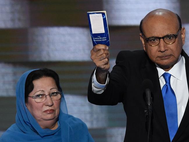 Khizr Khan, with his wife Ghazala, holding his personal copy of the US Constitution.  The Khans, the parents of a fallen Muslim American soldier, clashed with Donald Trump during the election campaign.  Picture:  AFP