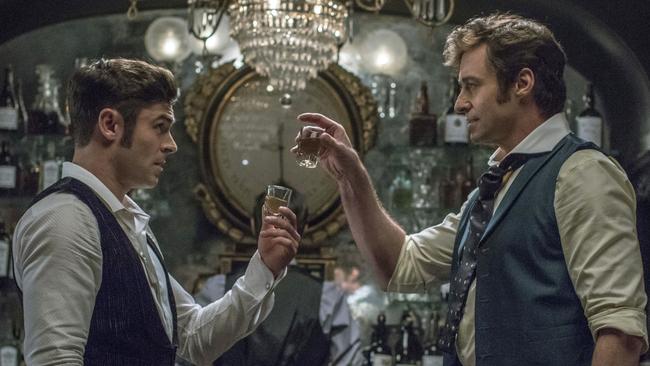 Zac Efron, left, and Hugh Jackman get their boozy buzz on in The Greatest Showman.