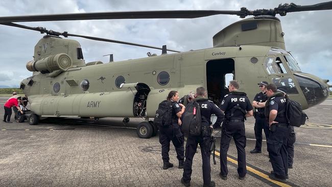 Police and other emergency personnel board Chinook helicopters to fly to the township of Waujal Wujal. Picture: Queensland Police