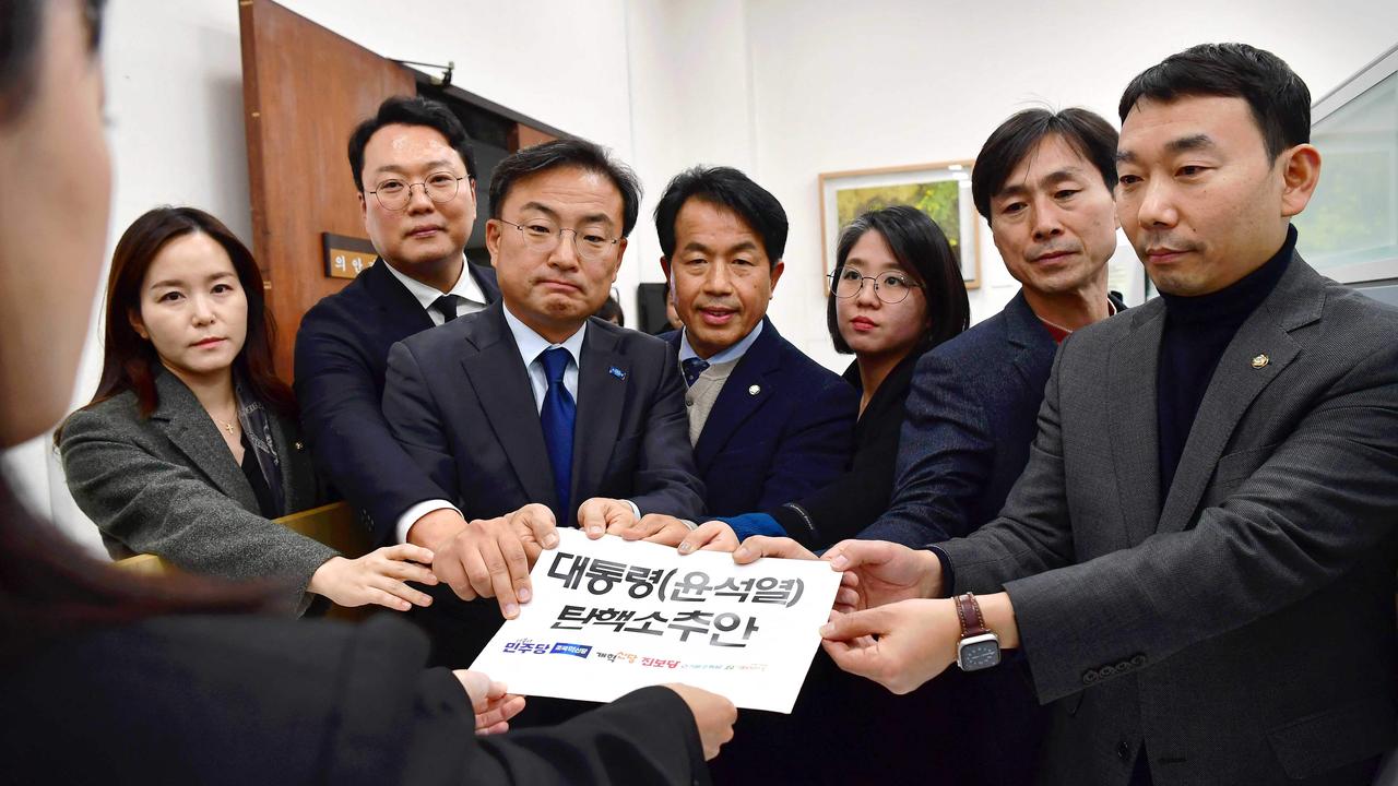 Opposition leaders submit an impeachment motion against South Korea President Yoon Suk Yeol. Picture: YONHAP / AFP