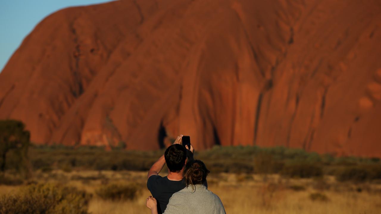 Tourists are still climbing Uluru despite pleas not to. Picture: Lisa Maree Williams/Getty Images