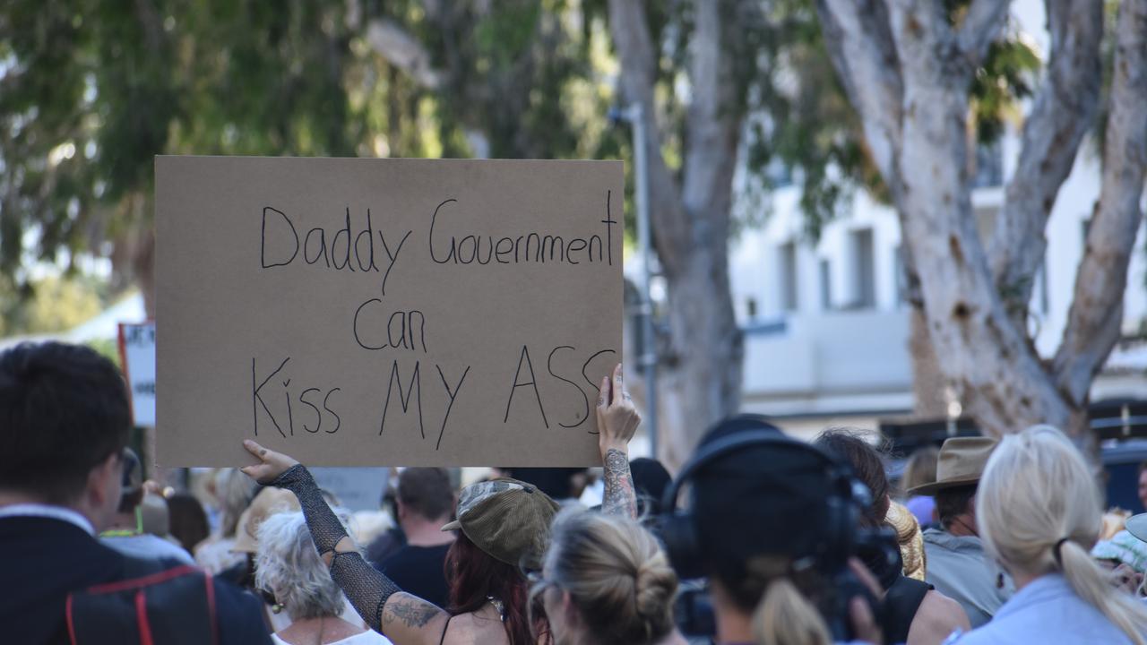 A sign reads ‘Daddy Government can kiss my ass’. Photo: Liana Walker