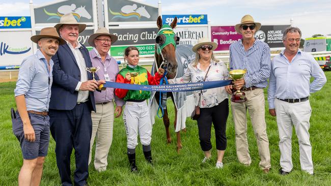 Jockey Caitlin Tootell celebrates alongside Stormsarrived, Kym and Lindsay Cadzow on Sunday. Picture: Makoto Kaneko