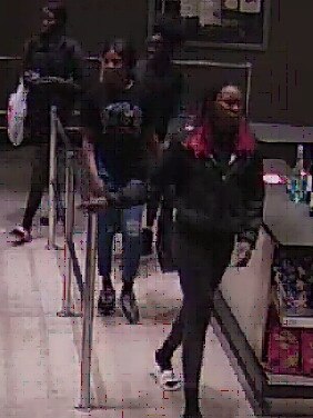 Four people police want to speak to regarding theft of alcohol from a Narre Warren store.