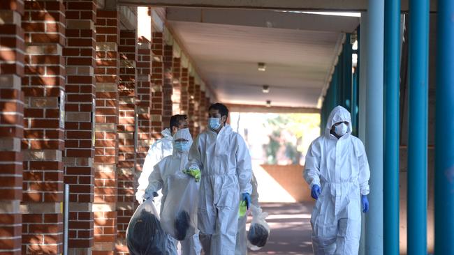 Cleaners at work at Wyndham College after a positive case was linked to the school. Picture: NCA NewsWire / Jeremy Piper