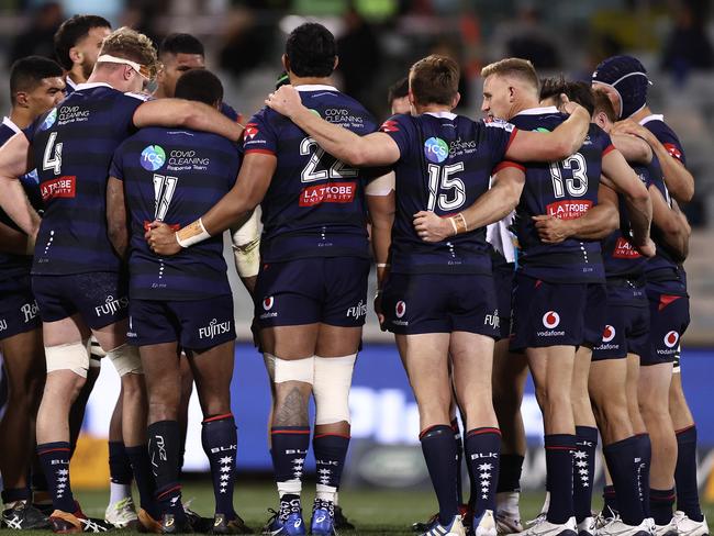 CANBERRA, AUSTRALIA - JULY 04: Rebels players huddle after a try during the round one Super Rugby AU match between the Brumbies and the Rebels at GIO Stadium on July 04, 2020 in Canberra, Australia. (Photo by Cameron Spencer/Getty Images)