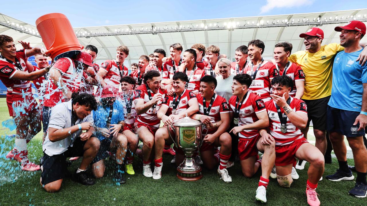 NRL National Schoolboys Cup final at CBUS Stadium between Palm Beach Currumbin and Patrician Blacktown Brothers. The Red Army and Palm Beach Currumbin players celebrate the win. .Picture Glenn Hampson