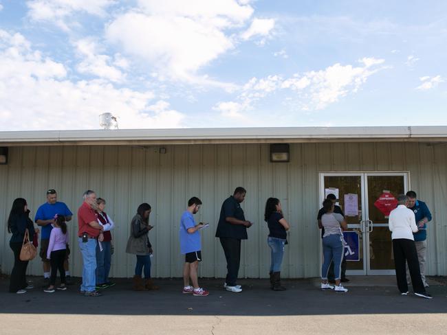 Voters line up at the Gwinnett County Fairgrounds polling location on November 8, 2016 in Lawrenceville, Georgia. After a contentious campaign season, Americans go to the polls today to choose the next president of the United States. Picture: Jessica McGowan/Getty Images/AFP == FOR NEWSPAPERS, INTERNET, TELCOS & TELEVISION USE ONLY ==