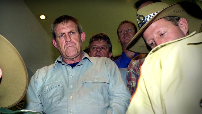 SSIMAGE: Bradley John Murdoch arrives under police escort at Darwin Airport to face murder charges of British backpacker Peter Falconio. Pic By Patrina Malone