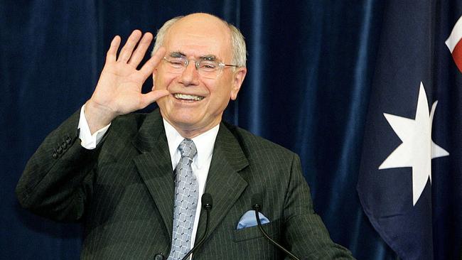 A triumphant John Howard wins the 2004 federal election. Picture: AFP