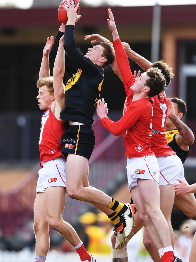 Lachlan Hosie takes a strong mark for Glenelg against North Adelaide. Picture: Image AAP/Mark Brake