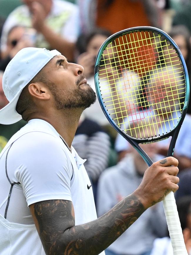 The Aussie star celebrates beating his opponent comfortably in three sets.