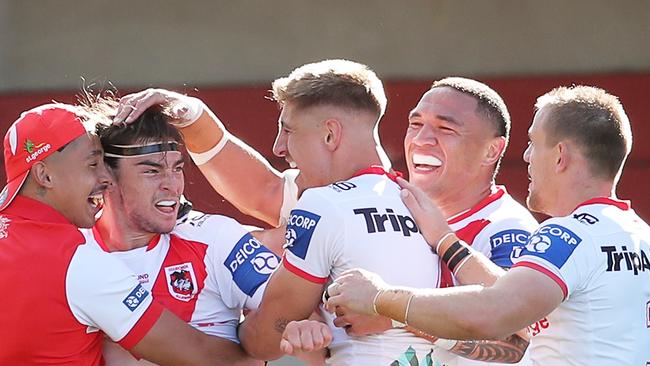 Cody Ramsey is popular with his teammates after scoring a try against the Canberra Raiders.