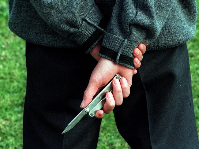 Gang member and student from Sarah Redfern High at Minto carries a knife to school. NSW / Education / Teenagers / Gangs / Knives weapons protection youth crime violence juvenile generic