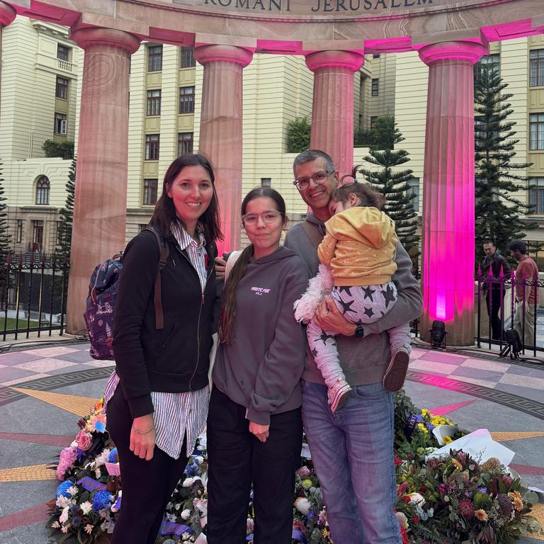 Sarah Pekacz, mother, Marce Jennings-Temple and his two daughters Ayda Ohlson (right) and Nora Jennings-Temple (left) at Brisbane's Anzac Day dawn service.