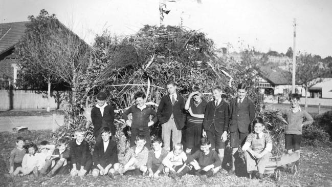 Children gathered around a bonfire pile in a Melbourne suburb around 1937. Picture: Trove