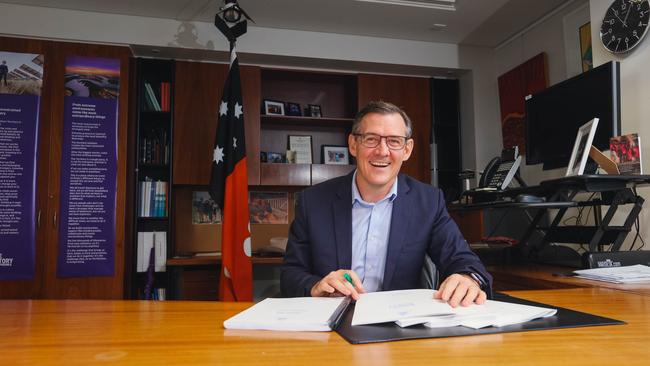 Chief Minister Michael Gunner leafing through budget papers. Picture: Glenn Campbell