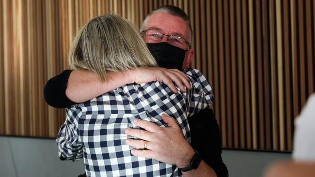 Siblings Susie and David Kiddie are reunited at the airport. Picture: Getty Images