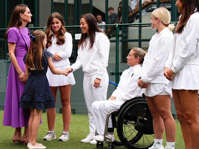 Catherine, Princess of Wales, (L) and her daughter Princess Charlotte of Wales (2ndL) meet tennis players before attending the men's singles final tennis match. Picture: AFP