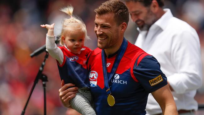 Demons vice-captain Jack Viney and daughter Mila at the Melbourne premiership party at the MCG.