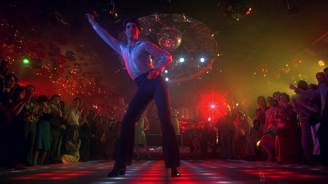 John Travolta on the dancefloor at the 2001 Odyssey nightclub in Brooklyn in a scene from Saturday Night Fever.