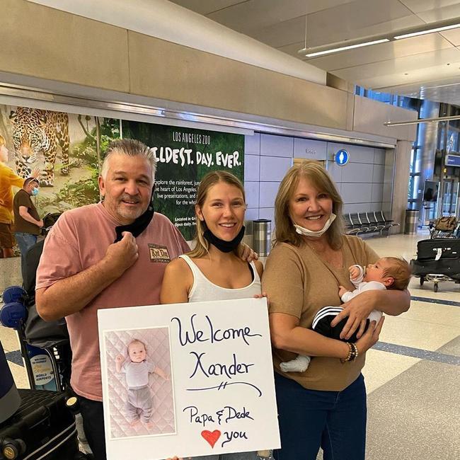 Mick Fanning his partner Breeana Randall and new son Xander have flown to America.