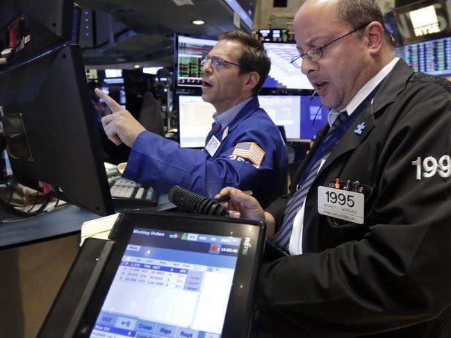 Specialist Charles Solomon, left, and trader Jeffrey Vazquez work on the floor of the New York Stock Exchange at the closing bell, Tuesday, June 2, 2015. U.S. stocks closed slightly lower as a slump in utilities offsets a gain in energy stocks. (AP Photo/Richard Drew)