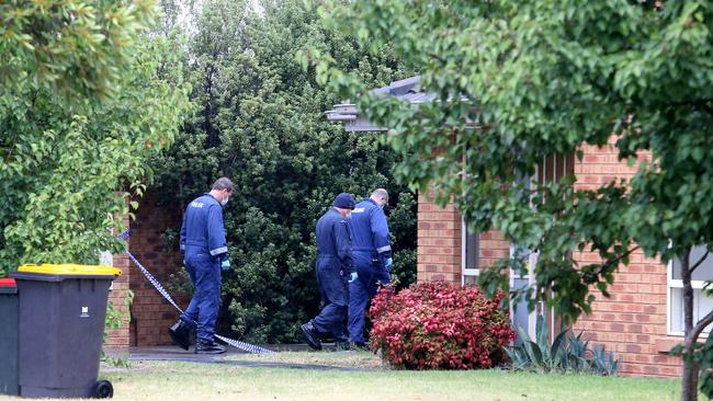 Investigators enter the home. Picture: Yuri Kouzmin