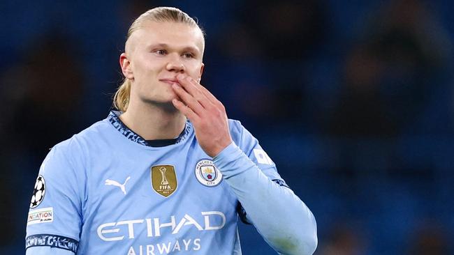 Manchester City's Norwegian striker #09 Erling Haaland reacts at the end of the UEFA Champions League football match between Manchester City and Feyenoord at the Etihad Stadium in Manchester, north west England, on November 26, 2024. Manchester City and Feyenoord equalised 3 - 3. (Photo by Darren Staples / AFP)