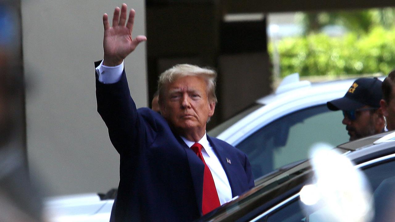 Former U.S. President Donald Trump waves as he makes a visit to the Cuban restaurant Versailles after he appeared for his arraignment on June 13, 2023 in Miami, Florida. Picture: Alon Skuy/Getty Images/AFP