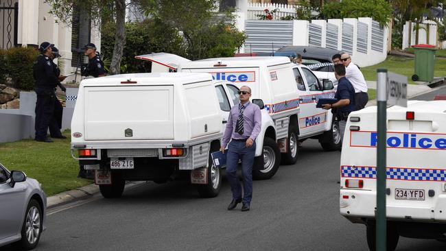 Police and detectives outside the house in Varsity Lakes where Mrs Beever’s body was found. Picture: Tertius Pickard.