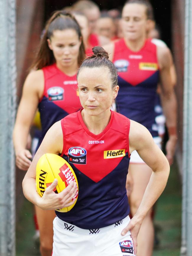 Daisy Pearce leads the Demons out.