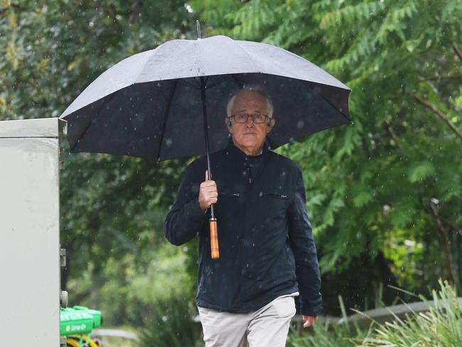 28/11/18: Former PM, Malcolm Turnbull walks in the rain near his home at Point Piper, Sydney. John Feder/The Australian.