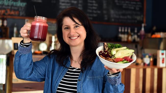 Cheers to a hearty meal of Soul bowl salad and mixed juice. Pictured is Annex Cafe owner Tina Williams. Picture: Tom Huntley