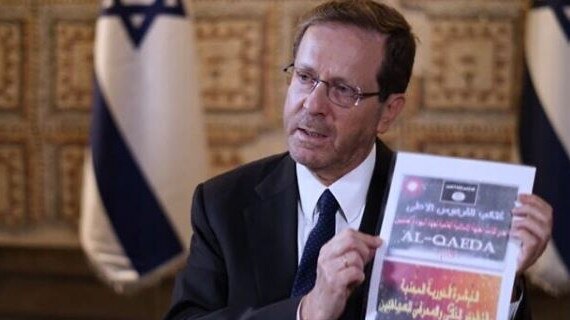 President Isaac Herzog shows materials recovered from the body of a Hamas terrorist during an interview with Sky News. Picture: Sky News