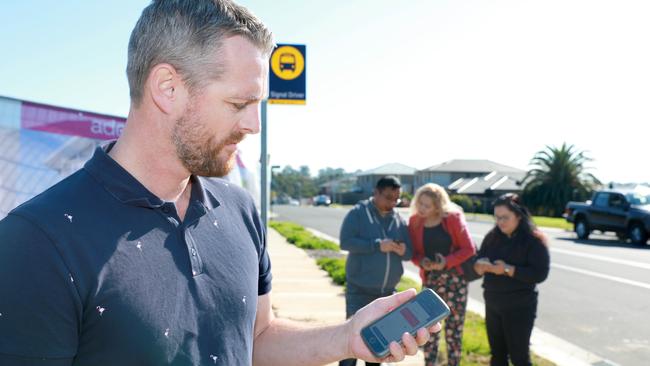 Jon Moran searches for on-demand bus services in Kellyville in the MetroConnect app. Picture: Angelo Velardo