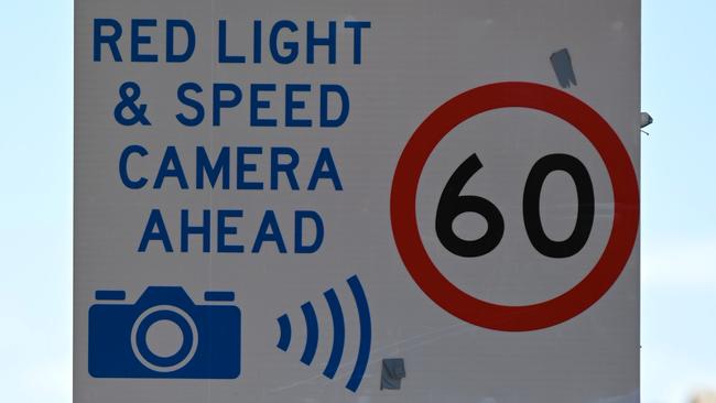 ADELAIDE, AUSTRALIA - NewsWire Photos OCTOBER 5, 2021: Stock/generic images of traffic signs - red light & speed camera/60km sign. Picture: NCA NewsWire / Naomi Jellicoe