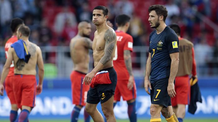 Australia's Tim Cahill, kenter, and Mathew Leckie walk on the pitch at the end of the Confederations Cup, Group B soccer match between Chile and Australia, at the Spartak Stadium in Moscow, Sunday, June 25, 2017. The game ended in a 1-1 draw. (AP Photo/Ivan Sekretarev)