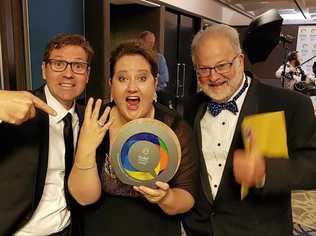 Cr Geoff McDonald, Kate Scott and Ross Begent celebrating the Carnival of Flowers' fourth win at the Queensland Tourism Awards last night. Picture: Contributed