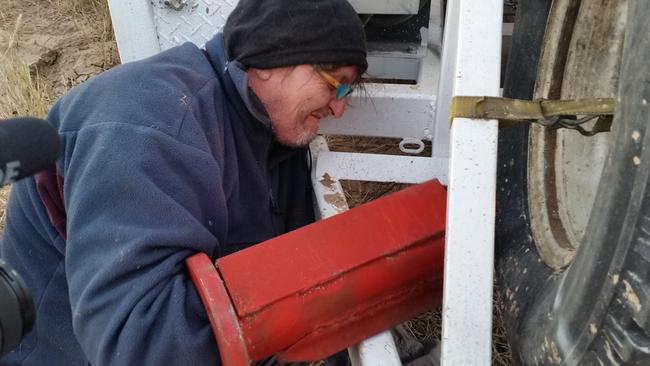 John Williams attached to the drilling rig using a ‘lock-on device’. Picture: Frontline Action on Coal.