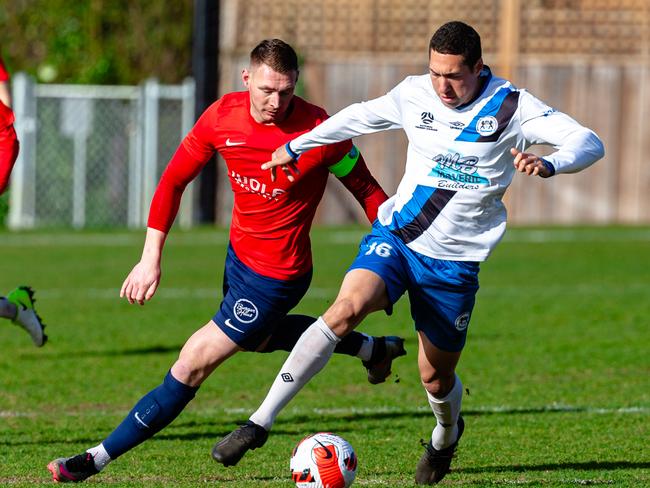 t Nick Morton of South Hobart and player/coach Alfred Hess of Kingborough Lions lock horns during Sunday’s game. Picture: Anthony Corke