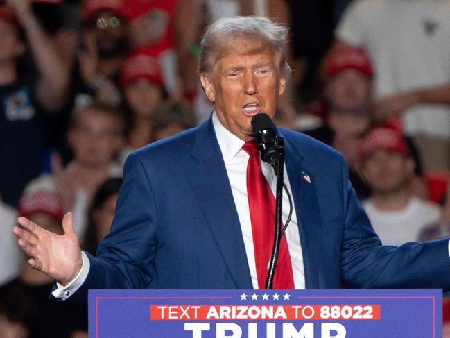 (FILES) Former US President and Republican presidential candidate Donald Trump speaks during a campaign rally at Mullet Arena in Tempe, Arizona on October 24, 2024. Donald Trump won the state of Arizona in this week's US presidential election, US TV networks projected on November 9, 2024, completing the Republican's sweep of all seven swing states. (Photo by Rebecca NOBLE / AFP)