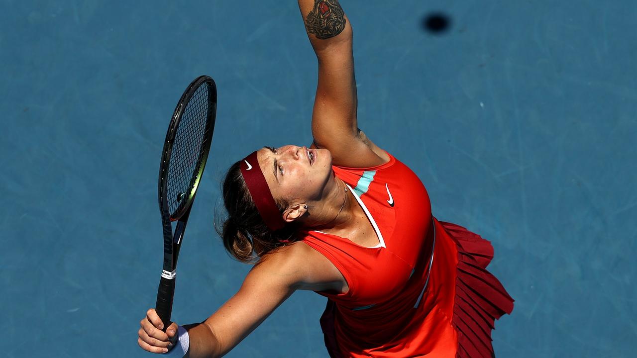 MELBOURNE, AUSTRALIA - JANUARY 20: Aryna Sabalenka of Belarus serves in her second round singles match against Xinyu Wang of China during day four of the 2022 Australian Open at Melbourne Park on January 20, 2022 in Melbourne, Australia. (Photo by Mark Metcalfe/Getty Images)