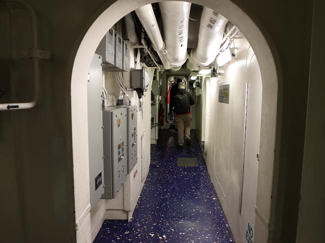 One of the maze of passageways on the USS America. Picture: Liam Kidston