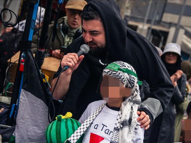 Burgertory boss Hash Tayeh with child wearing Hamas-style headband at a pro-Palestine rally on Sunday July 21. Picture: Wardenclyffe Photography| Kenji Wardenclyffe