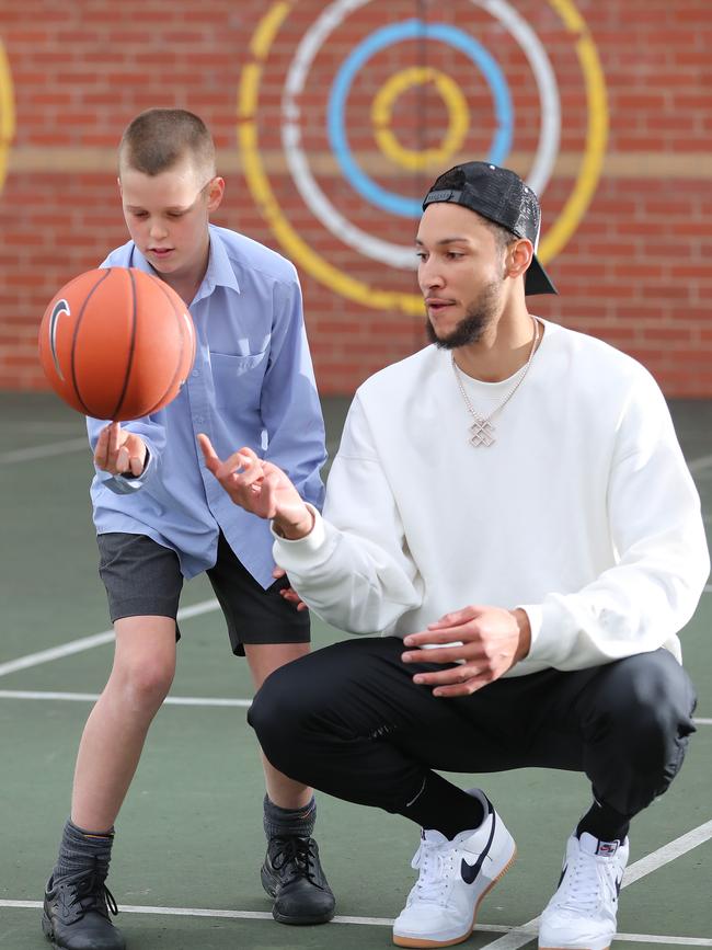 Simmons gives Charlie Sweet a few tips. Picture: Alex Coppel