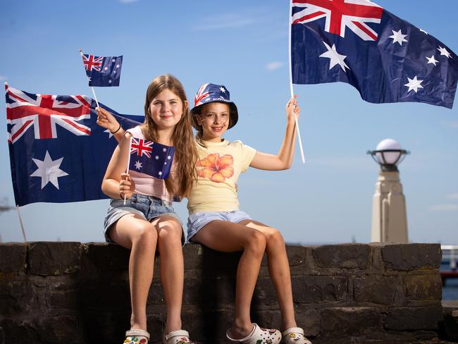 Eloise McCormack and Lyla Marinovic have their national flags ready to celebrate Australia Day in Geelong. Picture: Mark Stewart